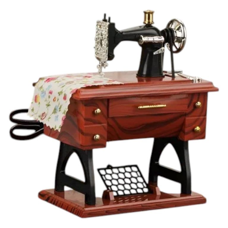 MAQUINA DE COSER CAJA DE MUSICA Y MOVIMIENTO NC35